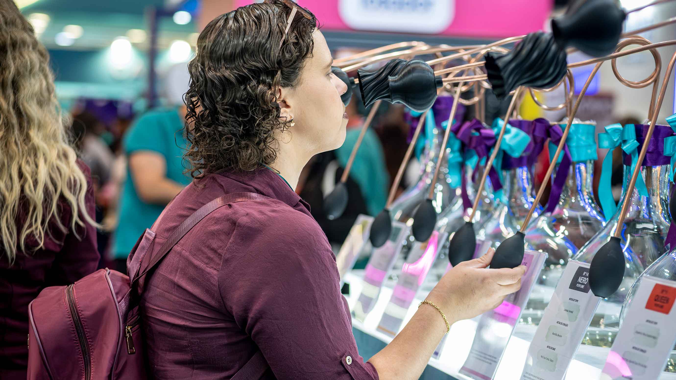 A visitor at PET South America looks at the products